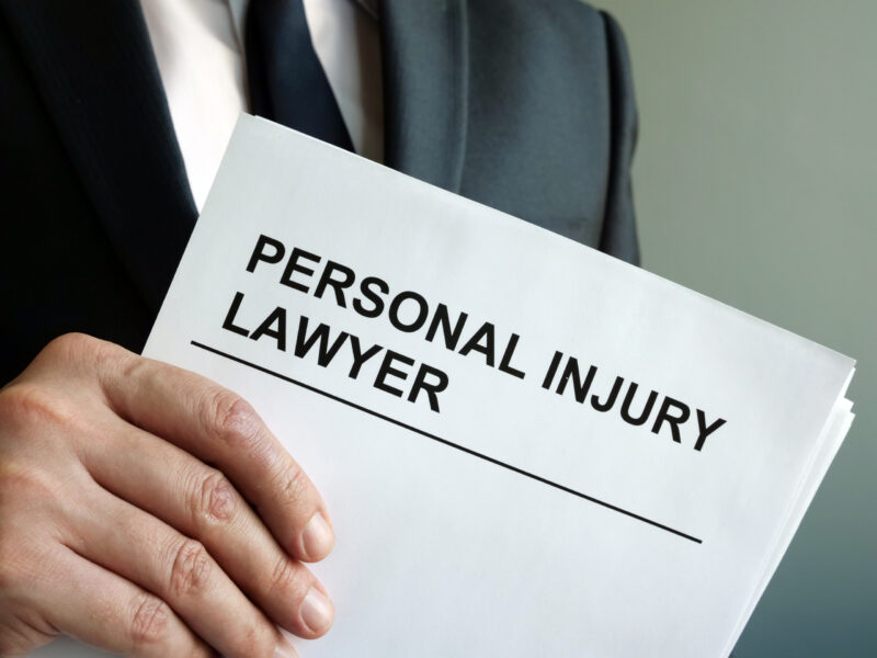 Personal injury lawyer with clipboard and law